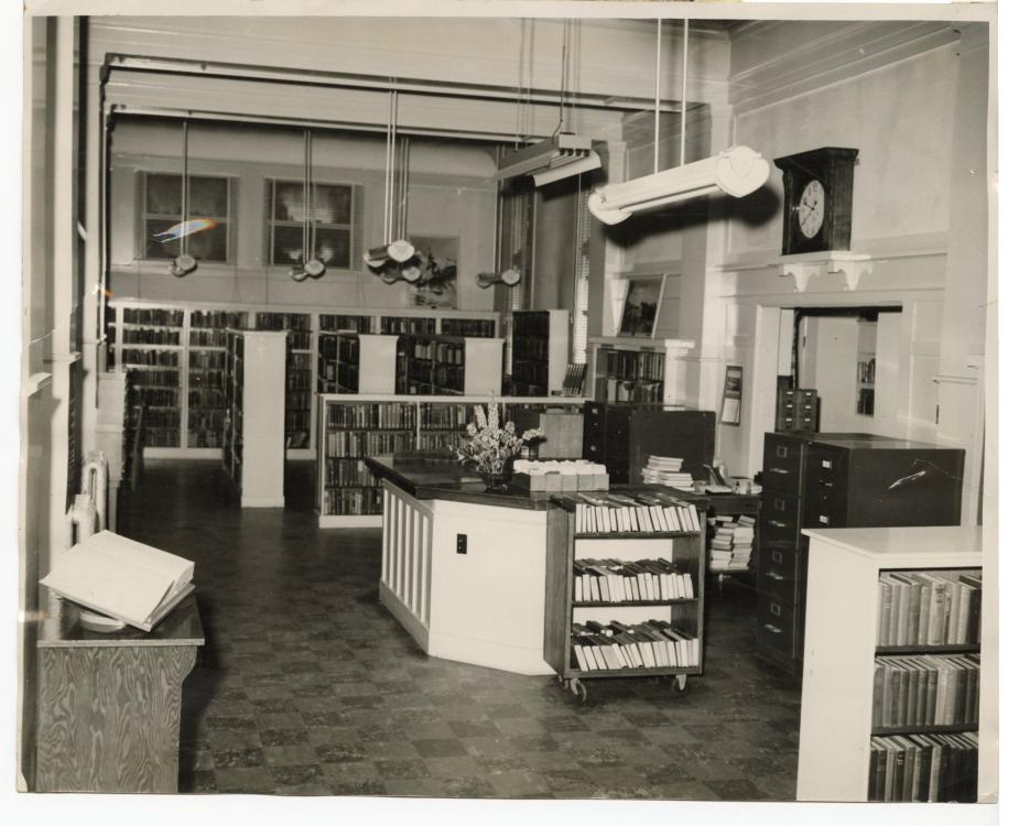 Black-and-white photo of the Carnegie Library circulation desk, circa June 1946